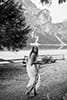 bride walking while admiring the beauty of dolomites- Dolomites Elopement