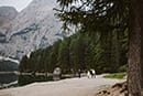 wedding venue detail of bride and groom walking from a distance- Dolomites Elopement