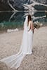 bride walking with her bridal dress flowing- Dolomites Elopement