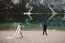 bride and groom first look in their bridal wedding dress and suit- Dolomites Elopement