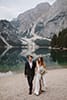 bride and groom walking with a background of dolomites' beauty- Dolomites Elopement