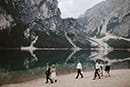 bride and groom with some of their loved ones walking in the beauty of Dolomites- Dolomites Elopement