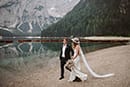 bride and groom walking and admiring the Italian nature- Dolomites Elopement