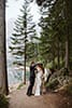 groom fixing bride's bridal accessories- Dolomites Elopement