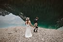 bride and groom going down to the beautiful lake of Dolomites- Dolomites Elopement