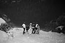 bride and groom with their small guests admiring the beauty of Italy in black and white- Dolomites Elopement