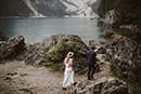 bride and groom walking in the rocky ground of Italy- Dolomites Elopement