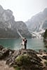bride and groom standing in the big rock and admiring the beauty of nature- Dolomites Elopement