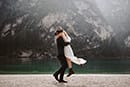 groom carrying his bride in the middle of Dolomites- Dolomites Elopement