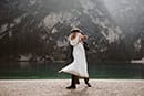 groom carrying bride and swaying deeply in the moment- Dolomites Elopement