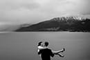 groom carrying bride in the edge of the mountain- Queenstown Wedding