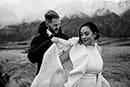 groom putting jacket to his bride- Queenstown Wedding