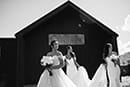 bride with her bridesmaids getting ready to walk down the aisle- Queenstown Wedding 