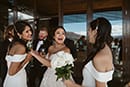 bride greeted happily by her bridesmaids- Queenstown Wedding