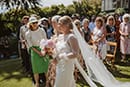 bride walking down the aisle with her mom- Taupo Wedding