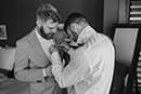 groom getting ready with his groomsman- Taupo Wedding