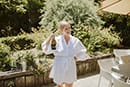 bride bringing wine while preparing for her big day- Taupo Wedding