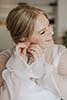 bride wearing her bridal earrings- Taupo Wedding