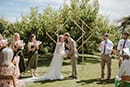 bride and groom in their first kiss as husband and wife