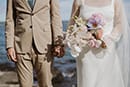 bride and groom standing featuring their wedding detail- Taupo Wedding